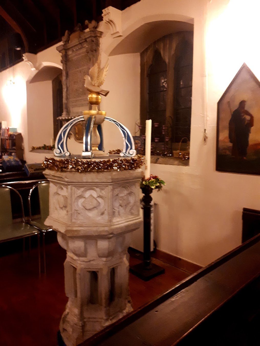 The historic stone font at St Nicholas Church