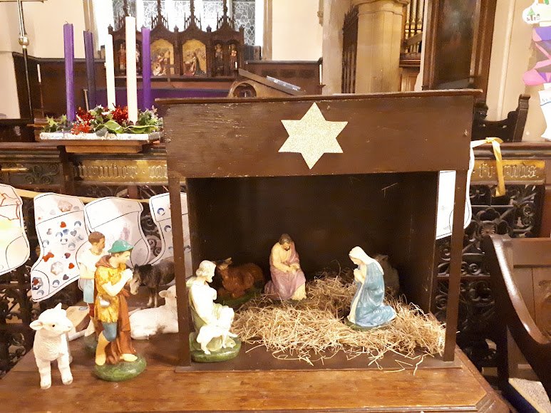 A nativity crib scene set up in the church at Christmas