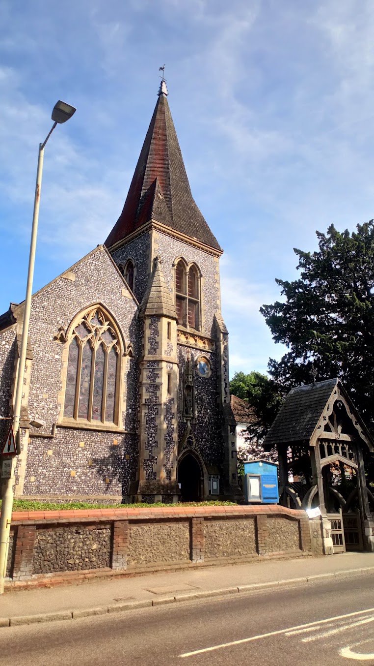 The spire of St Nicholas Church above the village street